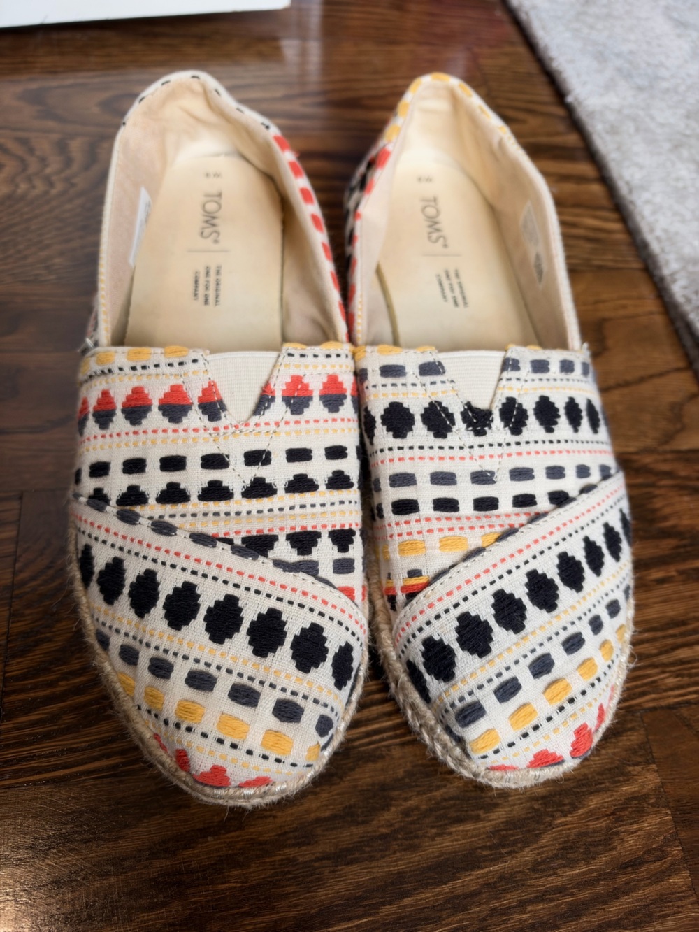 Toms Cream Canvas Espadrilles with Black, Red and Yellow Embroidery